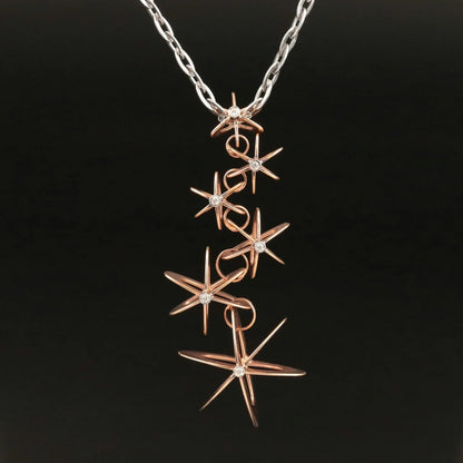 Authentic Roberto Coin 18k white and rose gold Two Tone Diamond Atomic Orbit Star Necklace 0.15 CTs